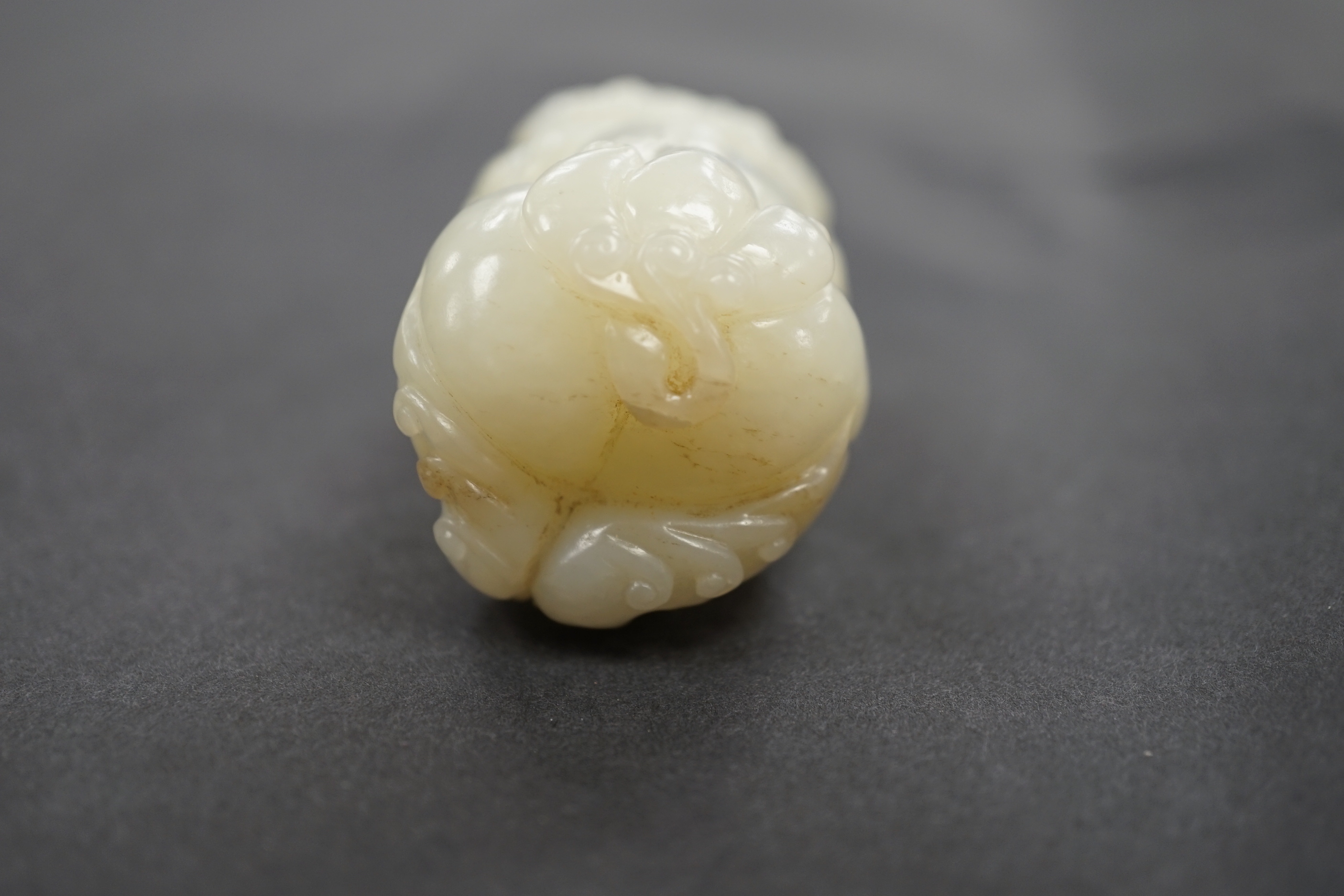 A Chinese white jade lion dog, 7cm